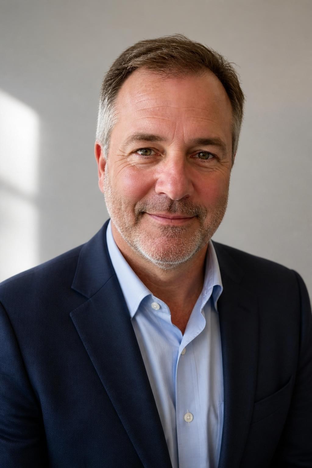 The same realtor in a studio realtor headshot